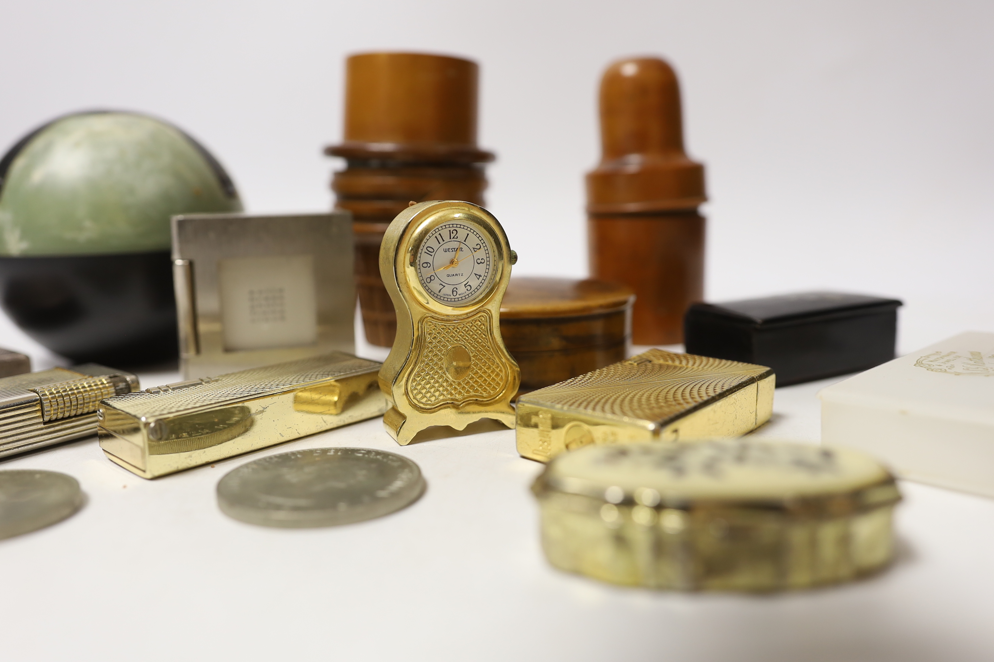 Sundry items including lighters, treen and miniature clocks